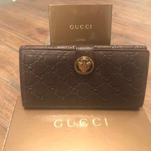 Gucci Monogram Embossed Brown Leather Wallet